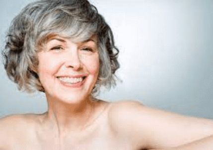 A smiling, middle-aged woman